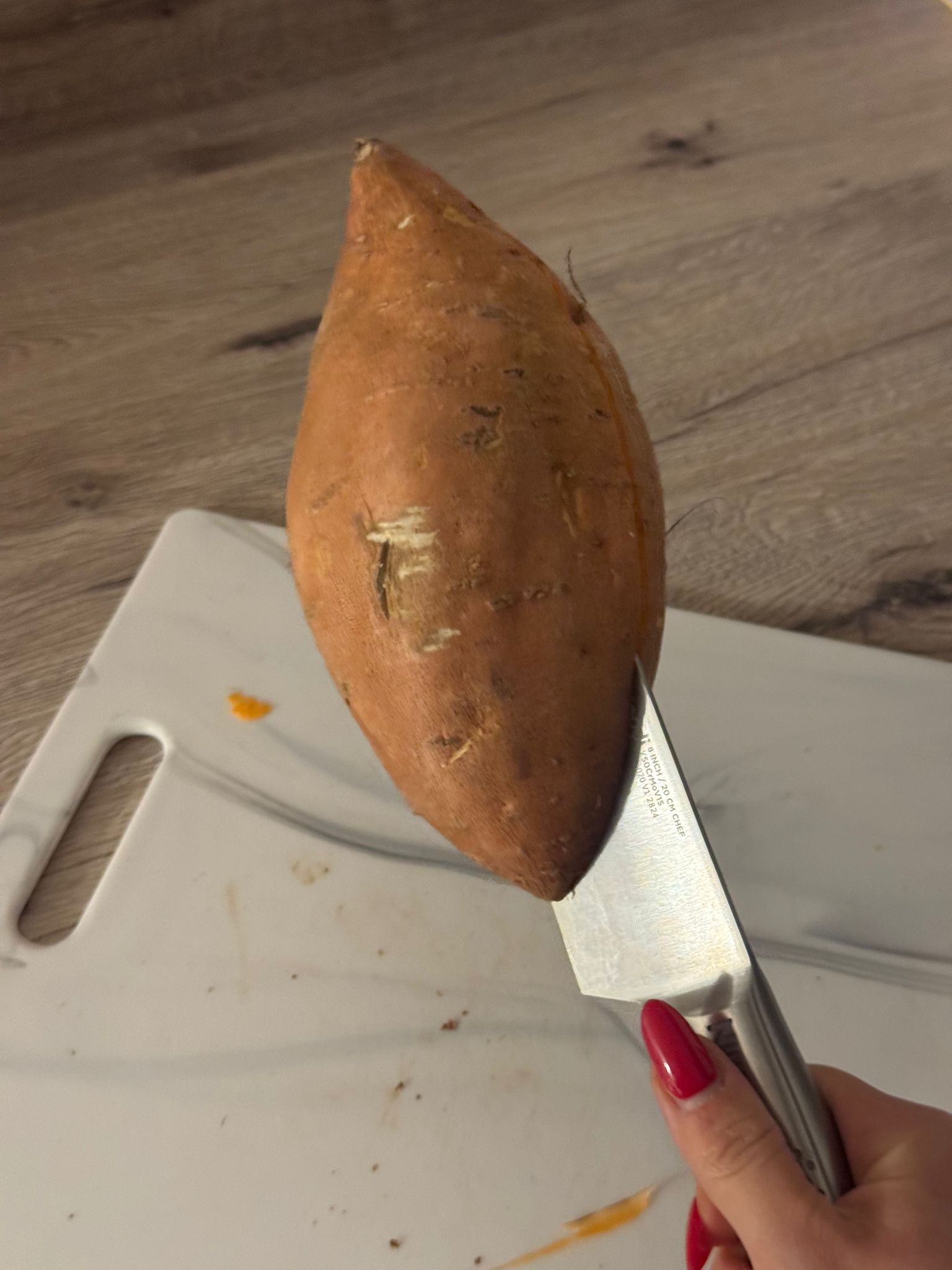 Knife stuck in sweet potato